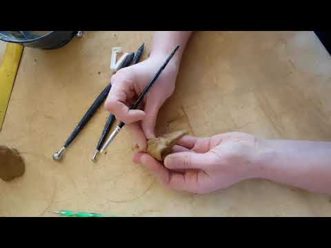 Bird skull pendant in clay