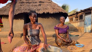 Cooking Pumpkins / African village woman.