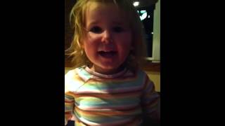 Madison and Olivia playing hide and seek at Chilis.