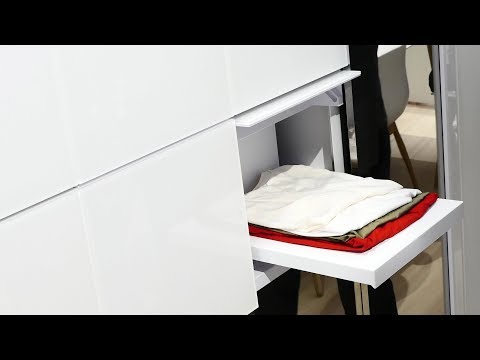 Panasonic presents a washing machine that folds your clothes and a fridge that comes when called