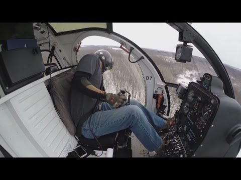 Helicopter with saw helps to trim around power lines