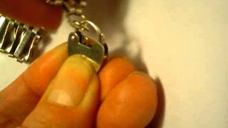 How to open and close the padlock clasp on a bracelet