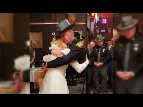 'Fathers in blue' surprise bride for father-daughter wedding dance