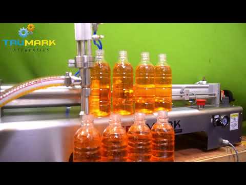SEMI - AUTOMATIC OIL FILLING AND CAPPING MACHINE