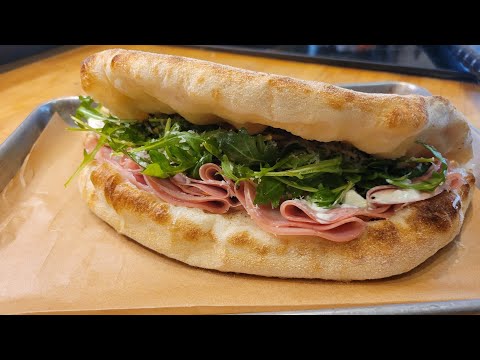 Panuozzo with Mortadella, Burrata, Pistachios, Arugula, White Balsamic Glaze and Pecorino Romano