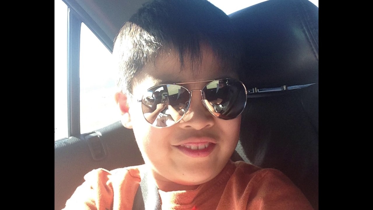 Gabby in the car with sunglasses on