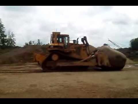Cat D9N Pushing Big Rock