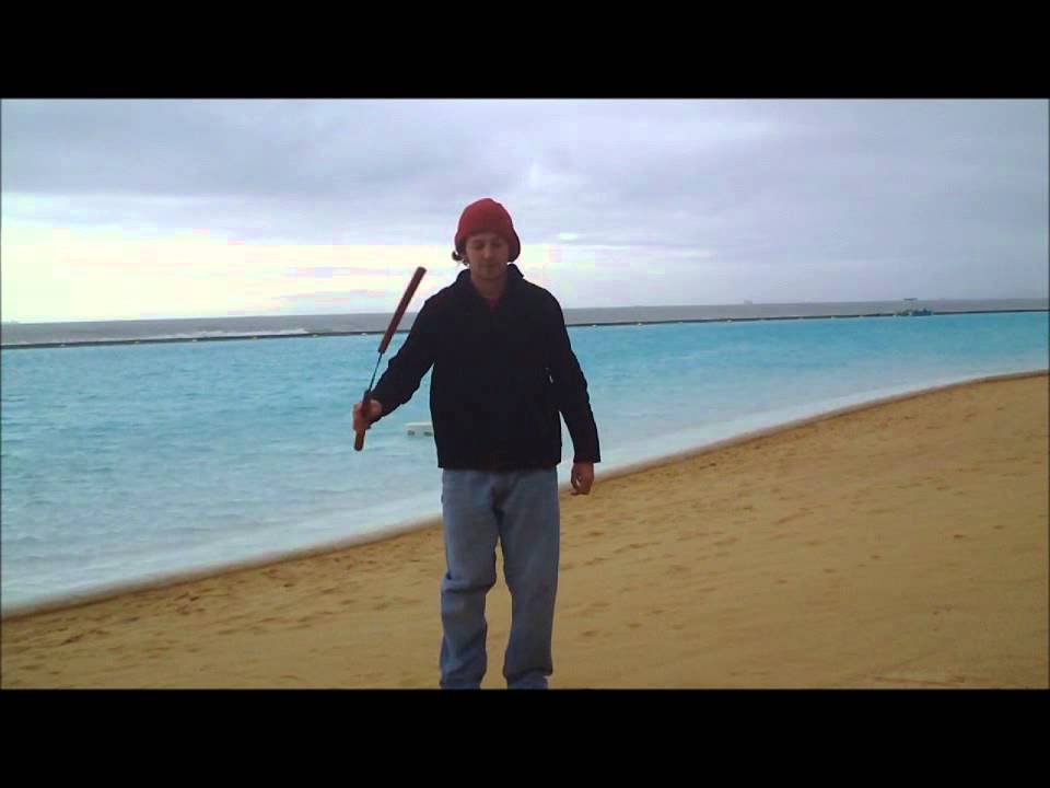 Difficult nunchuck trick: can can near leg