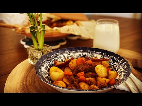 Slow cooked ribs with baby potatoes, carrots and onions