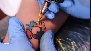 Autism spectrum puzzle piece tattoo