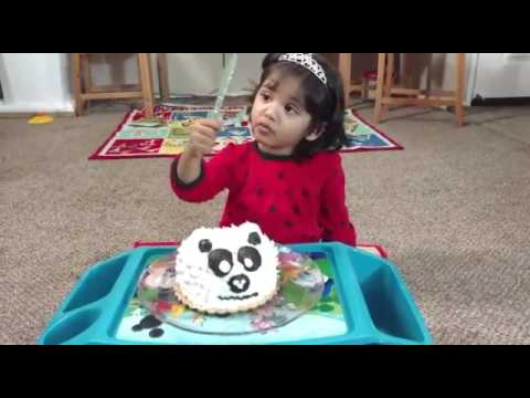 Panda cake. Cute baby Yusra! Cute expressions. Struggling to cut the cake.
