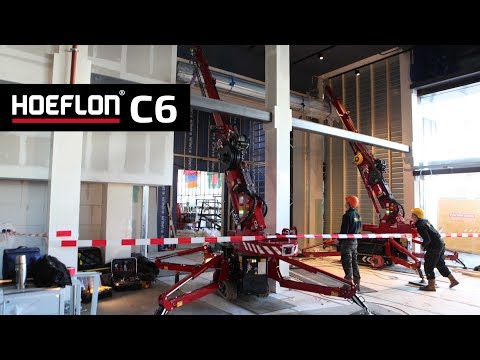 Installing a 2500 kg fireproof roller shutter with two C6 Compactcranes