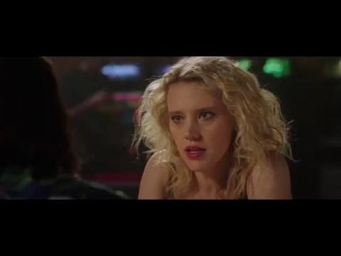 Official trailer frame for The Spy Who Dumped Me with Mila Kunis and Kate McKinnon running through a European street