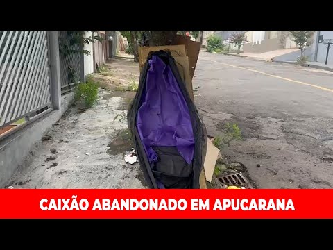 Abandoned coffin in public street draws attention and intrigues residents in Apucarana.