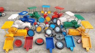 Green colour Mahendra tractor trolley tyres fitting and moving tractor video 