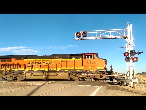 BNSF 8150 leads an autorack west over Hinkley Rd.