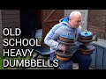 backyard gym heavy dumbbell bench press