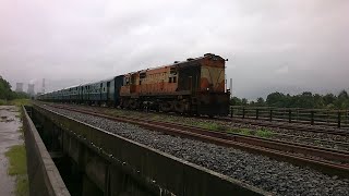 preview picture of video 'Drenched Gandhidham Nagercoil Express blasts at Nandikur in spite a heavy downpour.'