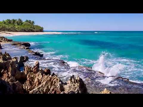 Splashing Waves All Day on Playa Encuentro - Refreshing and Relaxing on a Hot Summer Beach
