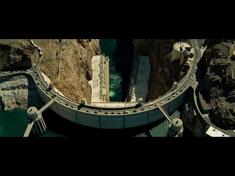 Transformers 2007 official trailer frame with Bumblebee and Sam under a sunset sky