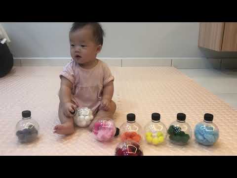 Baby Shermaine with her sensory color bottles