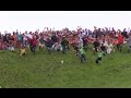 RAW: Cheese-chasers plunge down hill hunting ...