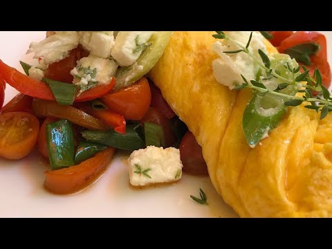 Omelette recipe, juicy, fluffy, cheesy, on sautéed legumes, topped with feta. Greek 🇬🇷 food recipe
