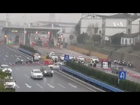 中國為遏制冠狀病毒宣佈封鎖更多城市