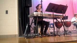 Elisa Lindberg singing and playing keyboard at Jean Vanier Collingwood