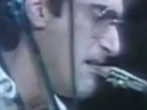 Slow motion close up shot of Michael Brecker's embouchure while and after he was breathing