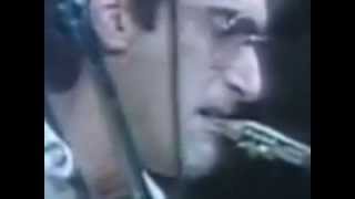 Slow motion close up shot of Michael Brecker's embouchure while and after he was breathing