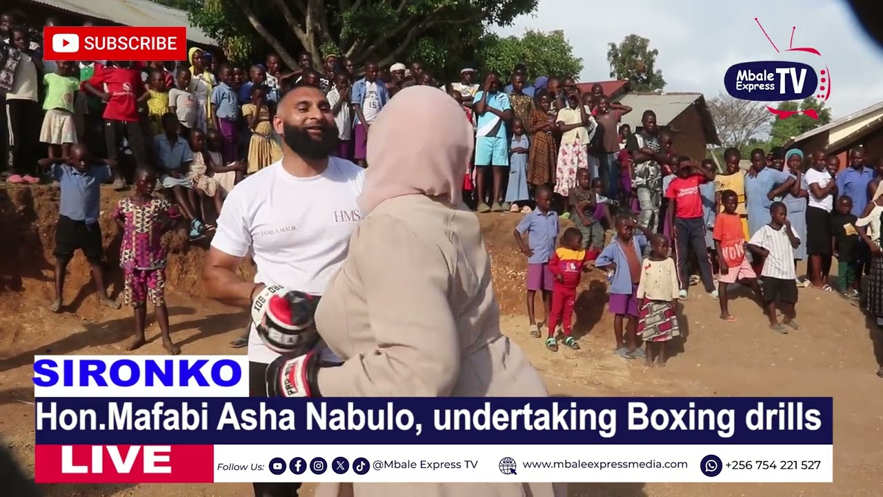 Hon. Asha Nabulo trying out her boxing skills
