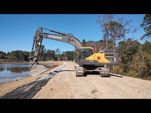 Installing Rock On The Dam Face  Huge 9 Acre Pond Project!