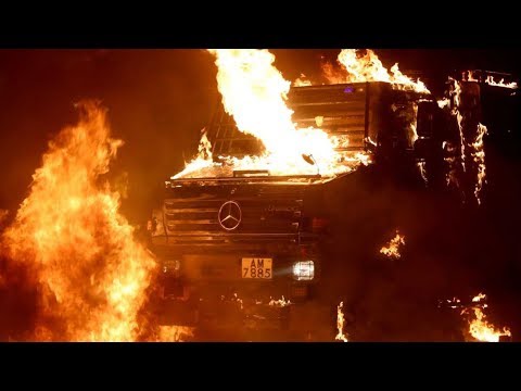 Hongkong police vehicle in flames from Molotov cocktail