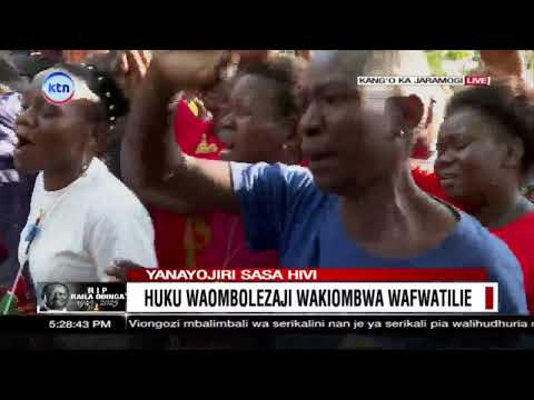 Mourners wail outside the Odinga residence after Raila's body is laid to rest