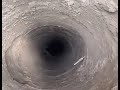 Chinese Man Singing Into A Hole In The Ground And Hitting Someone In The Head With Ice As They Reply