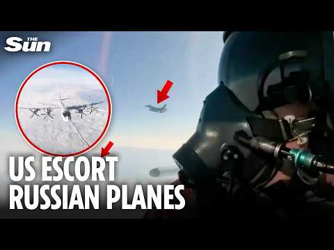 Moment Russian pilots film US fighter jets escorting them over Alaskan air space
