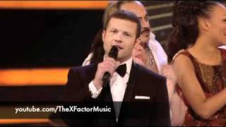 Harry Styles whispers to Matt Cardle in the X Factor Final.