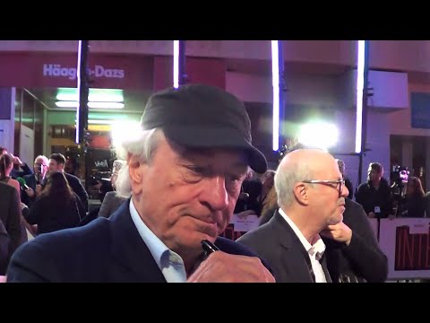 ROBERT DE NIRO signs a 'Taxi Driver' 1976 poster for the 'London Taxi Drivers Charity for Children'