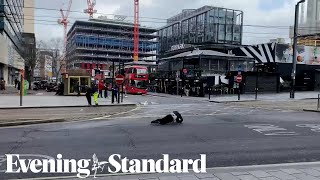 Pedestrians fall over in strong winds as Storm Eunice hits the UK