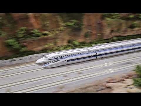 N-Scale Japanese Bullet Trains racing at full throttle on The "Grand Mesa" Model Railroad layout.
