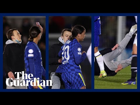 Chelsea striker Sam Kerr knocks pitch invader to ground during Champions League match
