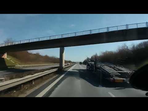 DIVING IN GERMANY. Autobahns A20 and A19 to Rostock. Spring day. Country views.