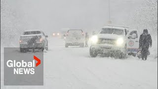 Heavy snow sweeps across Toronto area, causing traffic chaos