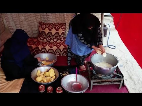 No to poverty by cooking. Afghanistan's Mothers cooking food for childrens to making them happy.