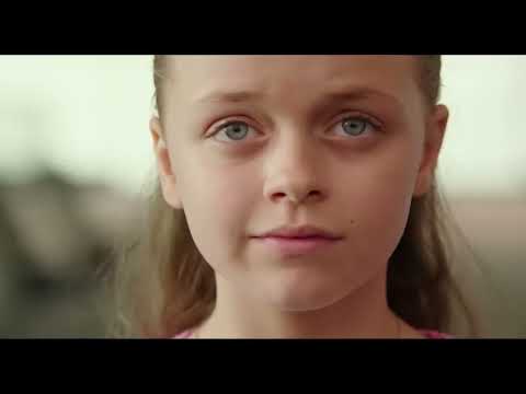 Hospital corridor scene from Miracles from Heaven with Christy pushing Anna in a wheelchair