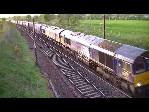 Class 66s head a Mossend - Daventry container train at Quintinshill. 31-5-17.