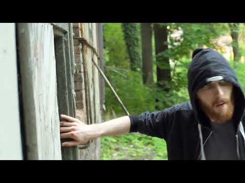 man walking in abandoned dark building and wearing hood steadycam shot