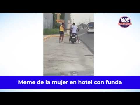 Hombre entra una mujer con una funda negra en la cabeza al hotel