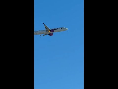 Flames shoot from jet engine on plane departing Las Vegas